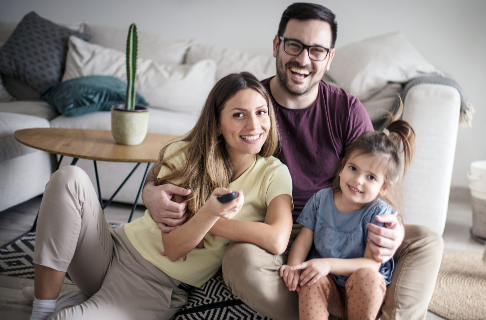 What is new? Family at home watching TV.